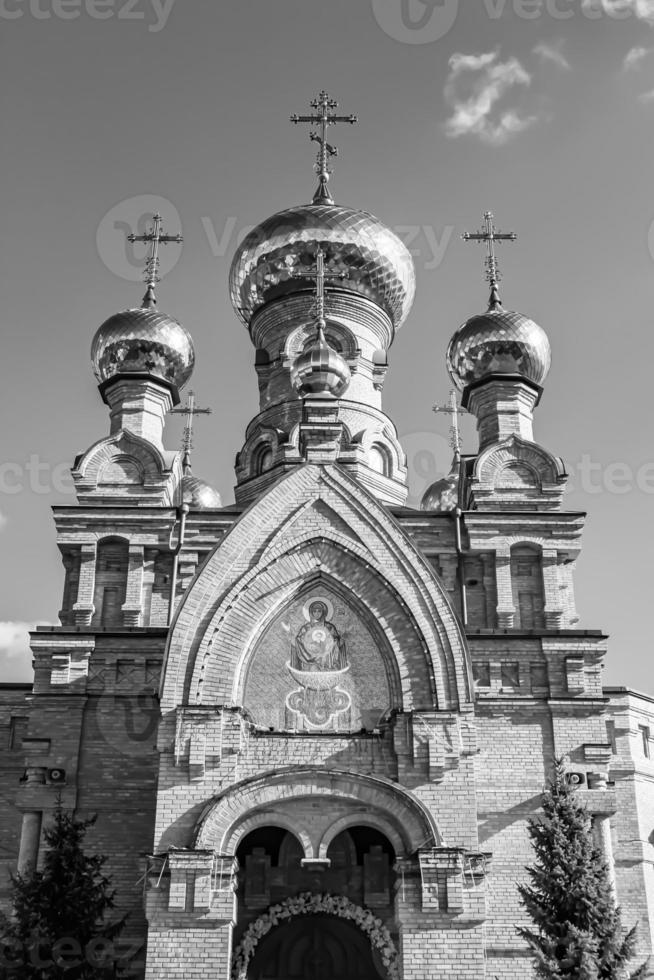 Christian church cross in high steeple tower for prayer photo