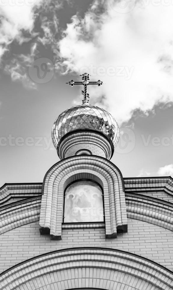 Christian church cross in high steeple tower for prayer photo
