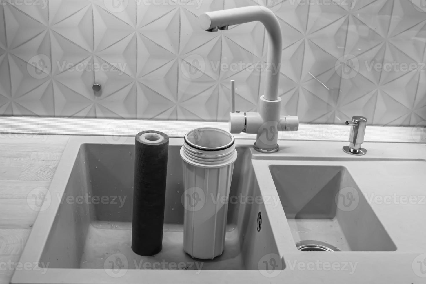 water filter cartridge for home on background kitchen photo