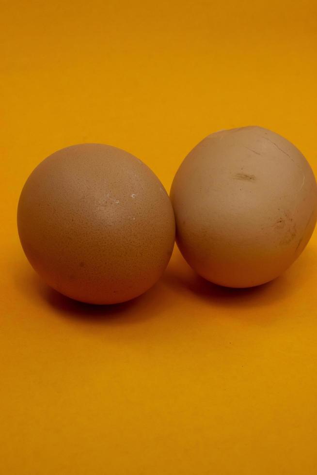 two chicken eggs isolated on  background photo