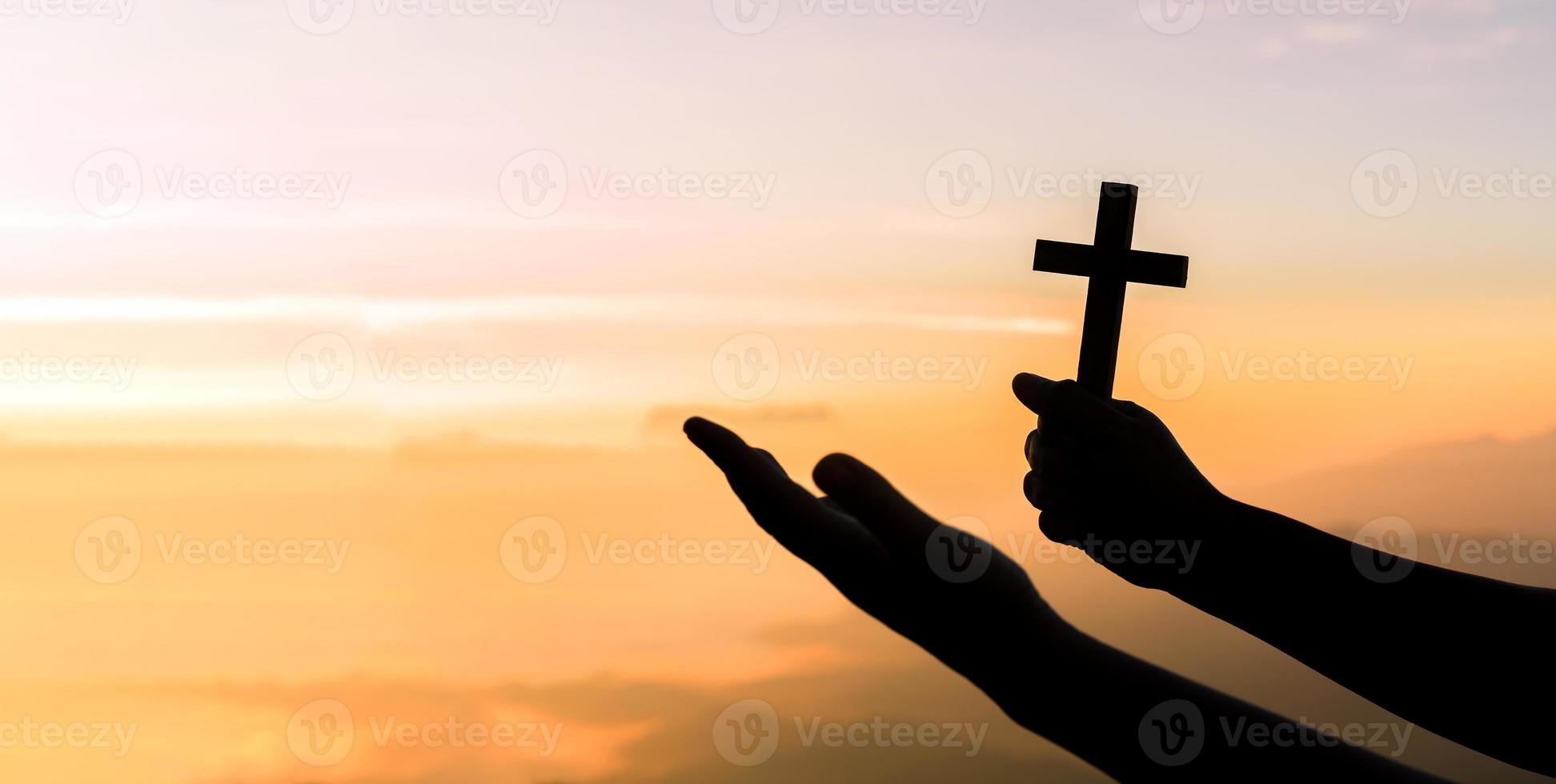 Cross is a symbol of Christianity. Human hands open palm up worship. Eucharist Therapy Bless God Helping Repent Catholic Easter Lent Mind Pray. Christian concept background. photo