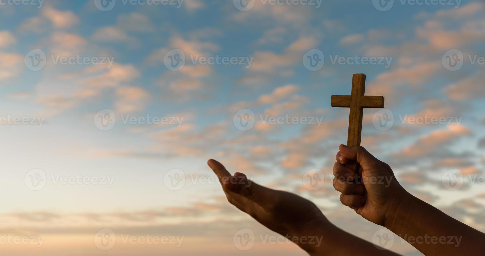 Cross is a symbol of Christianity. Human hands open palm up worship. Eucharist Therapy Bless God Helping Repent Catholic Easter Lent Mind Pray. Christian concept background. photo