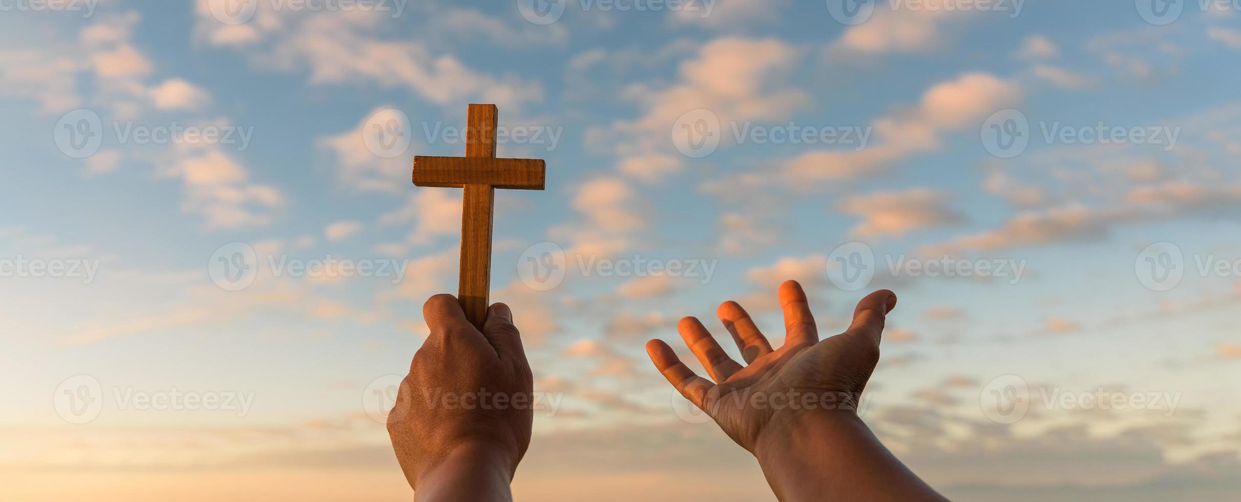 Cross is a symbol of Christianity. Human hands open palm up worship. Eucharist Therapy Bless God Helping Repent Catholic Easter Lent Mind Pray. Christian concept background. photo