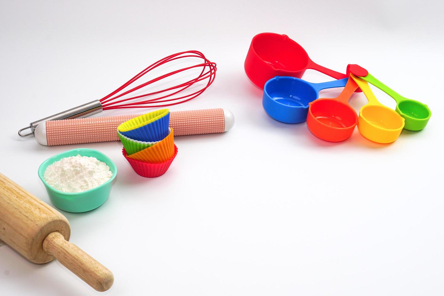 Set of kitchen utensils and ingredients for bakery on white background. photo