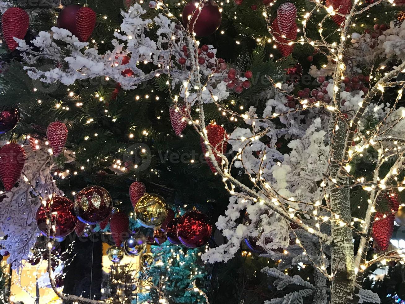 Christmas tree decorated with baubles and lights. New Year celebration concept photo