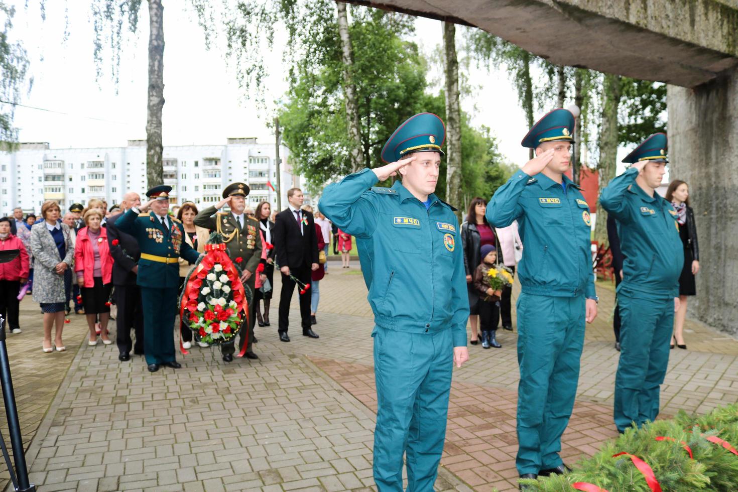 Men military and old man grandfather veteran of the Second World War in medals and decorations give honor show respect for the day of victory Moscow, Russia, 05.09.2018. photo