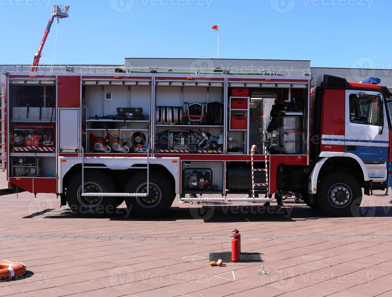 Large special red with blue fire car, engine to rescue people with open  sides and extinguishing equipment, fire pump, blowing agent, tool, water  sleeves, hoses, baloons, equipmen 14273914 Stock Photo at Vecteezy