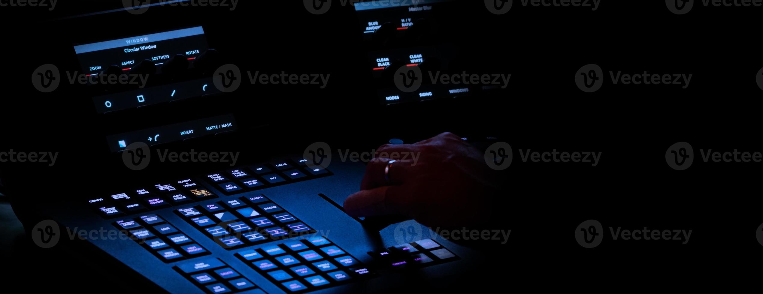 Edit video production control panel in studio. Editor editing and grade film in movie post room. photo