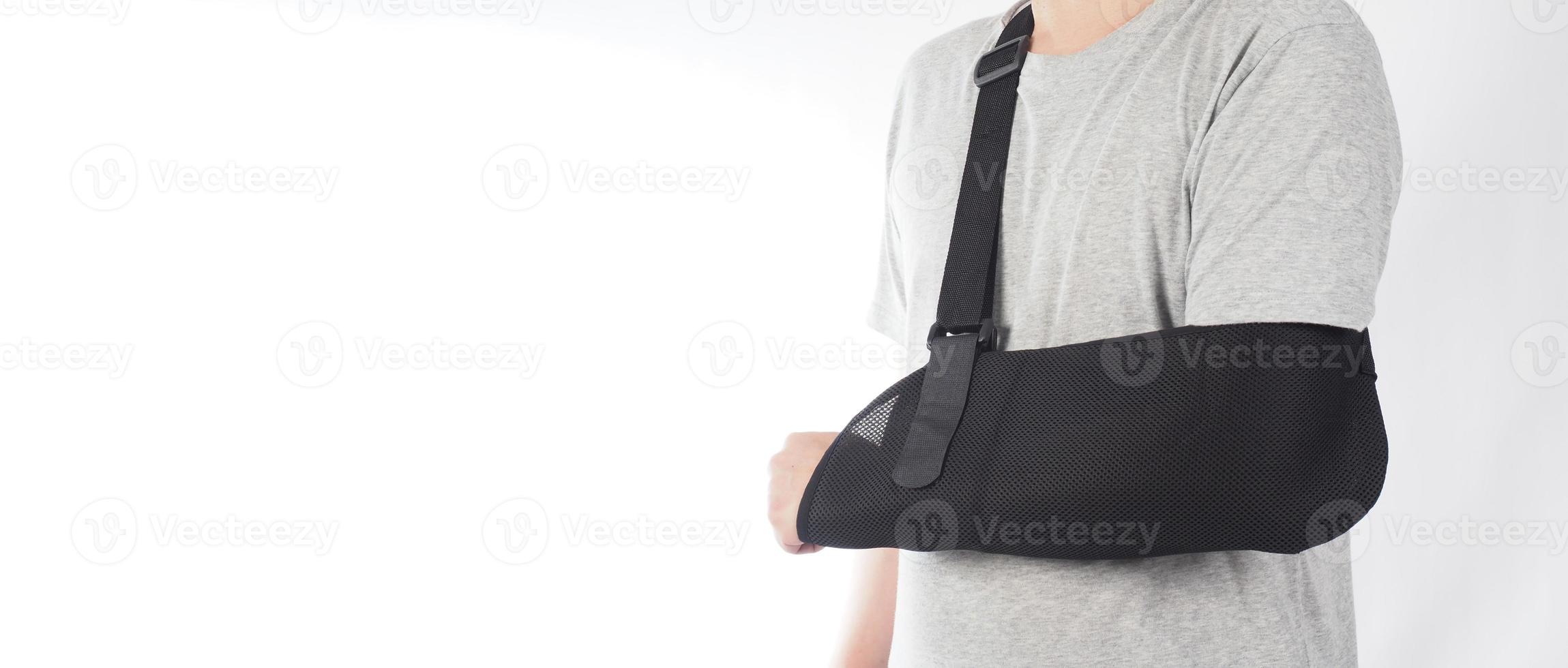 Broken arm. Arm Sling therapy support and covered around elbow first knuckle broken arm. photo