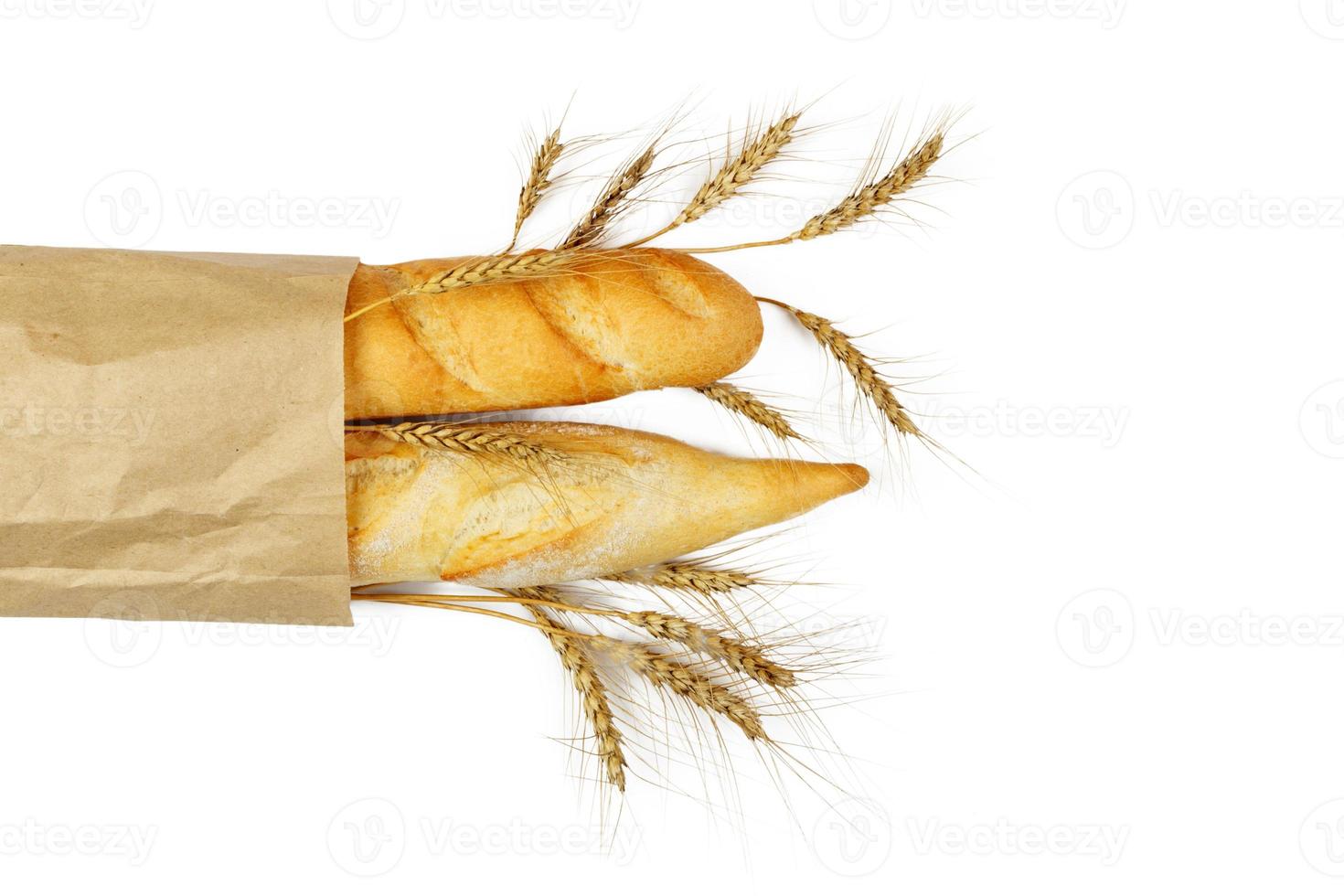 mini baguettes in pacage with wheat on white background photo