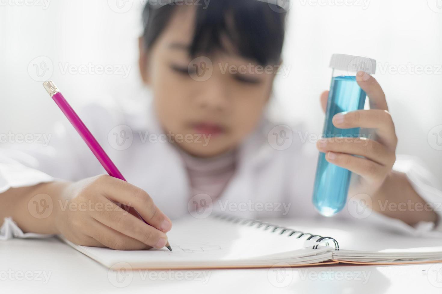 Asian Student Mixing Solution in Science Experiment Laboratory Class photo