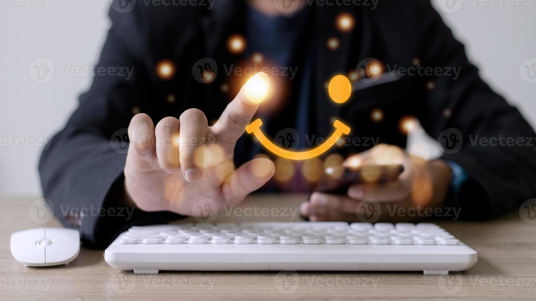 The consumer answered the survey in a conceptual way. Customer creates a happy face smiling symbol using a digital pen. The notion of customer happiness and service experience. photo
