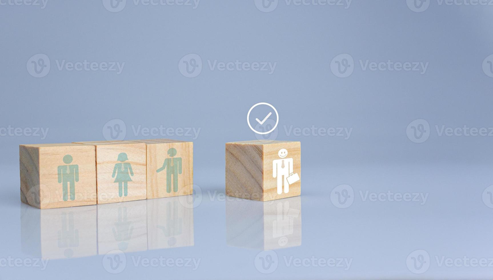 Concept of Business and HR for leadership and team leader. One cube wood block out in front  Different and stand out from the group photo