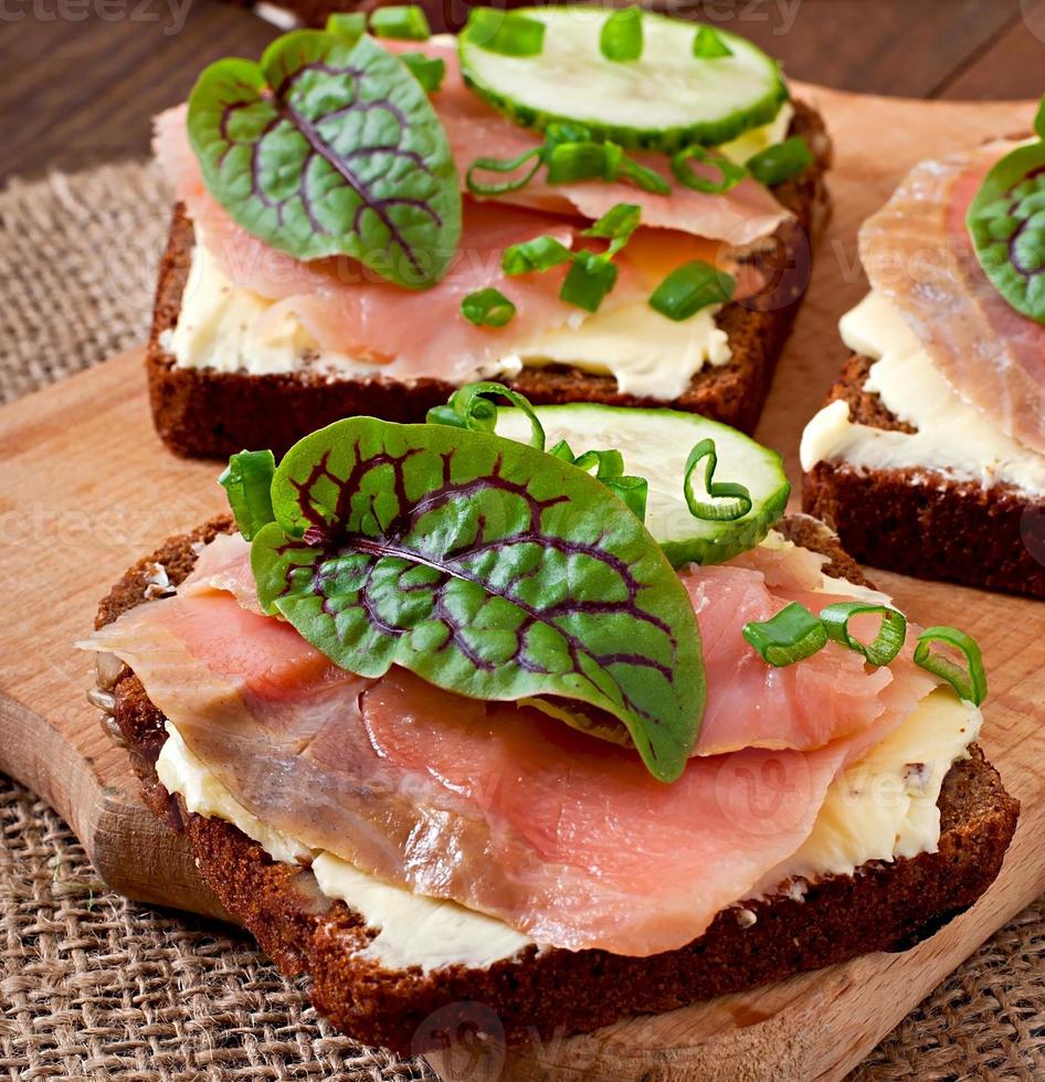Small snacks sandwiches with salty salmon photo