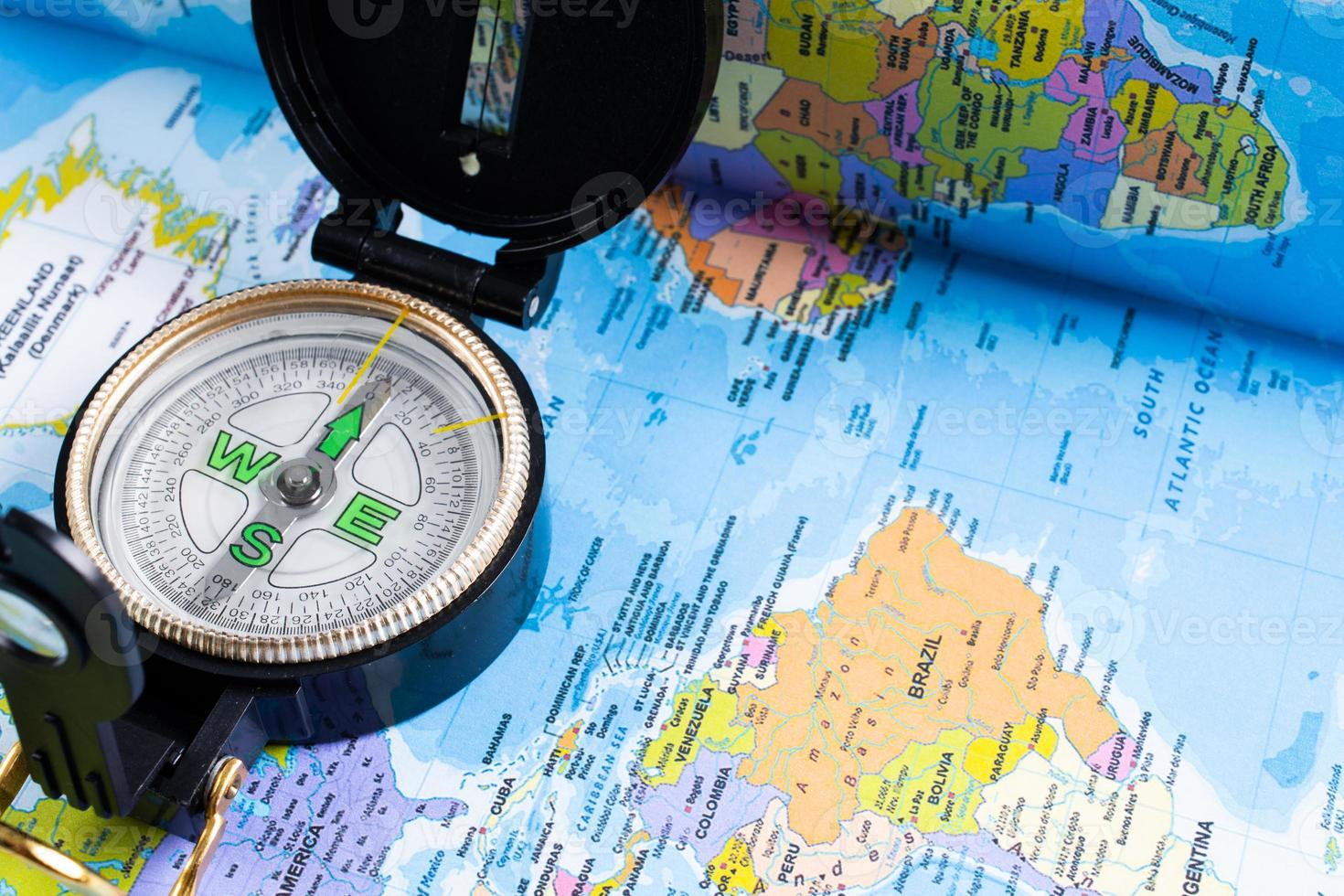 Concept of travel. Map and compass photo