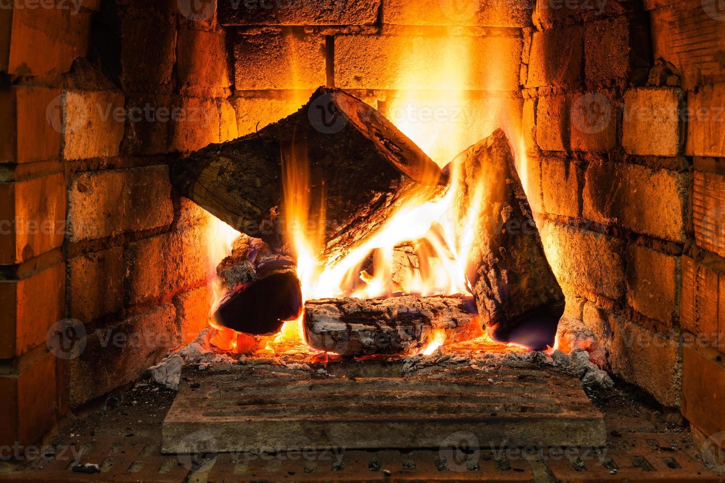 burning wood in fire-box of fireplace photo