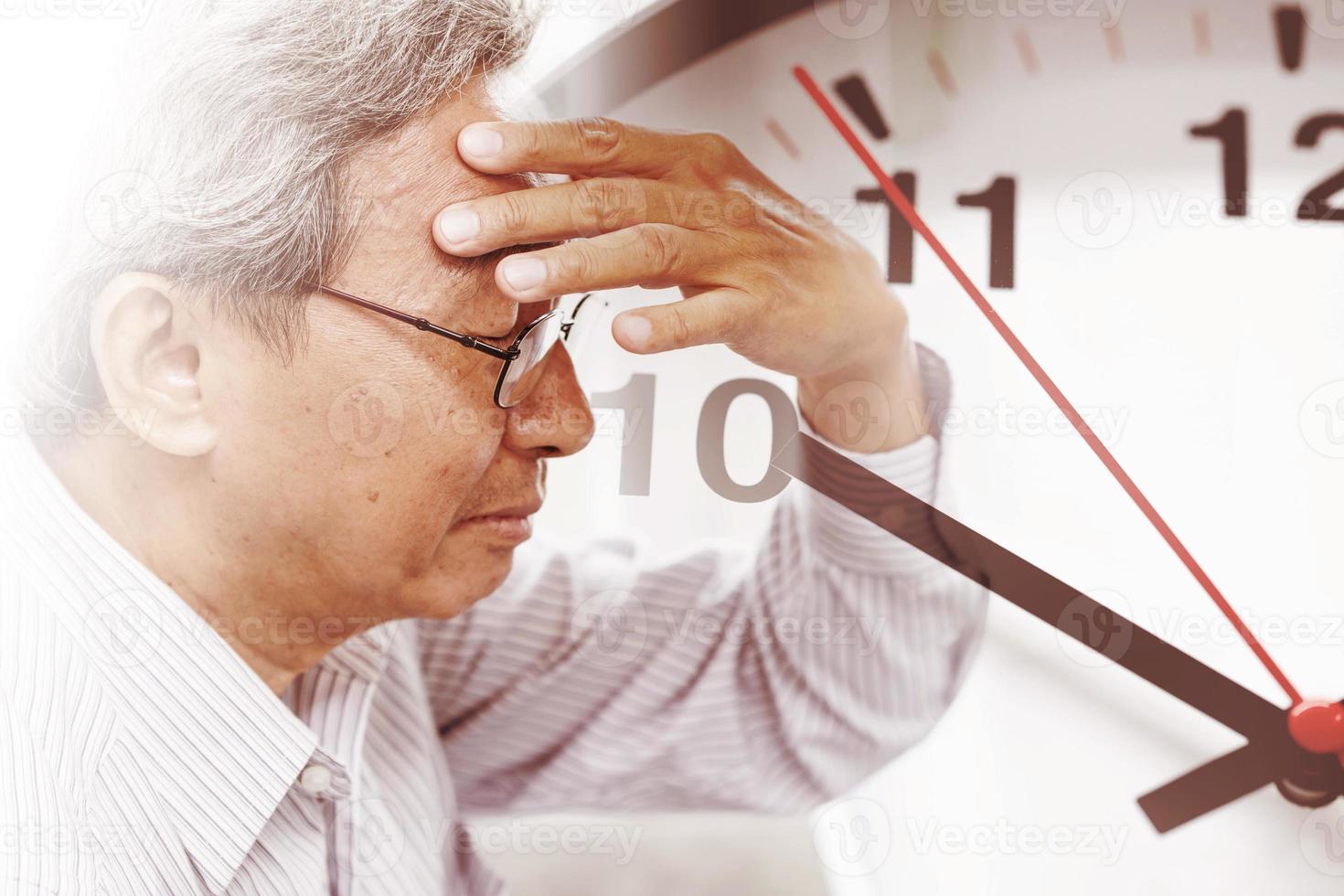 elder man time losing his memory from amnesia.  Brain Stroke death clock countdown concept. photo