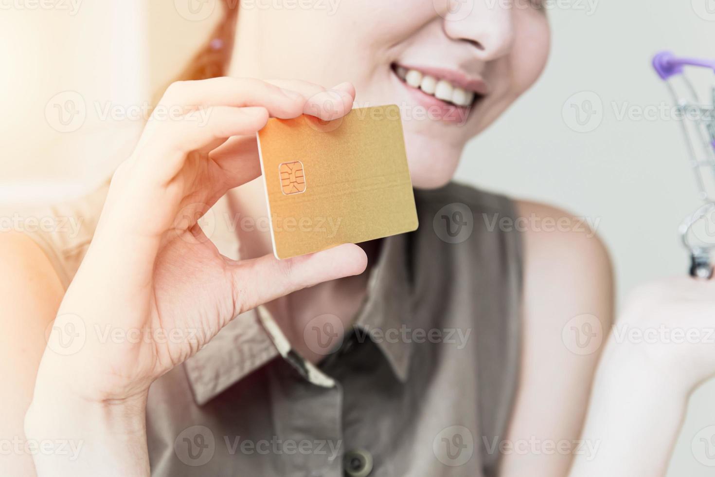 Closeup Girl teen hand using credit card with happy smile emotion concept photo