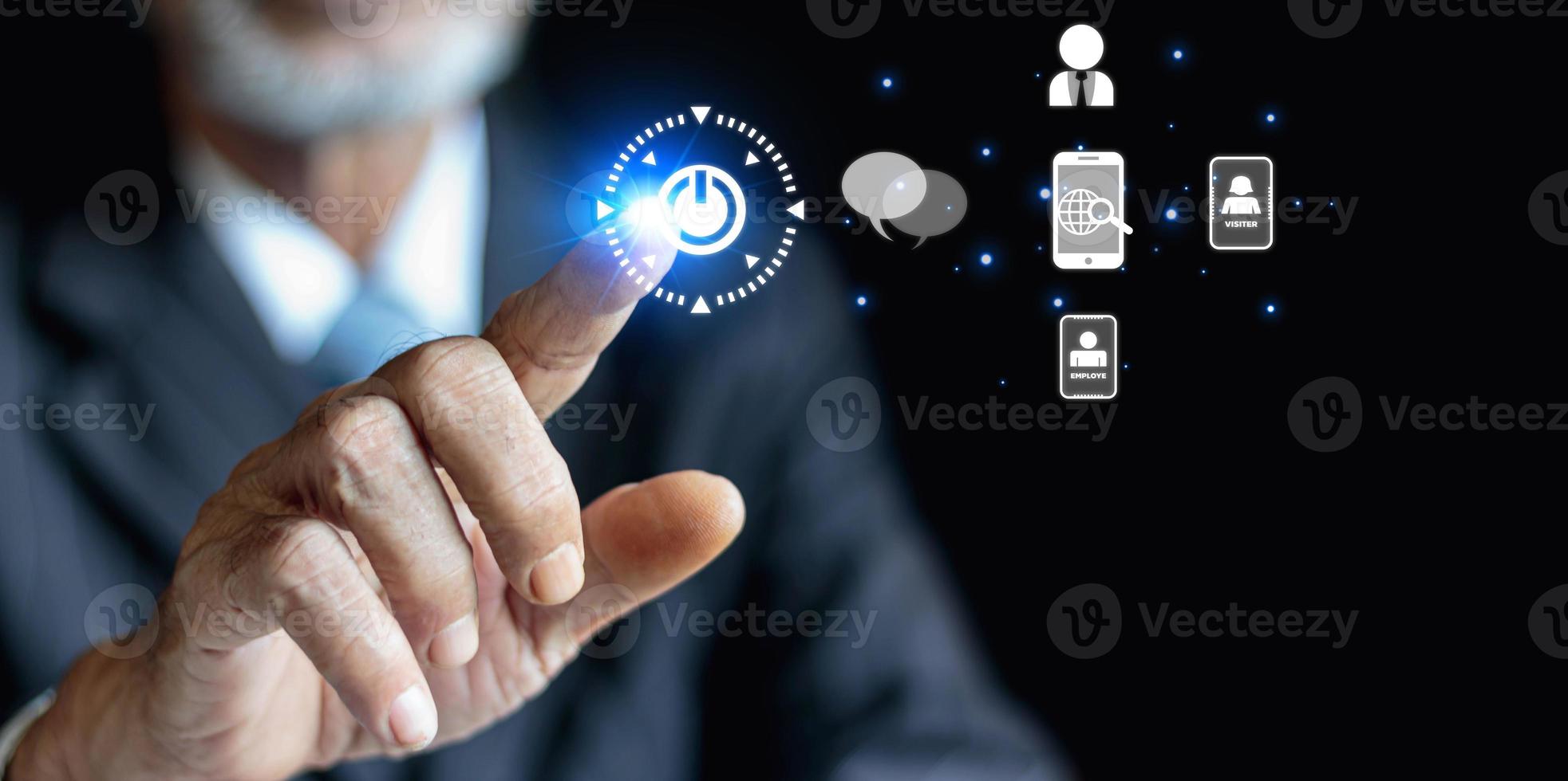 Businessman presses a high-tech button on a virtual background. photo