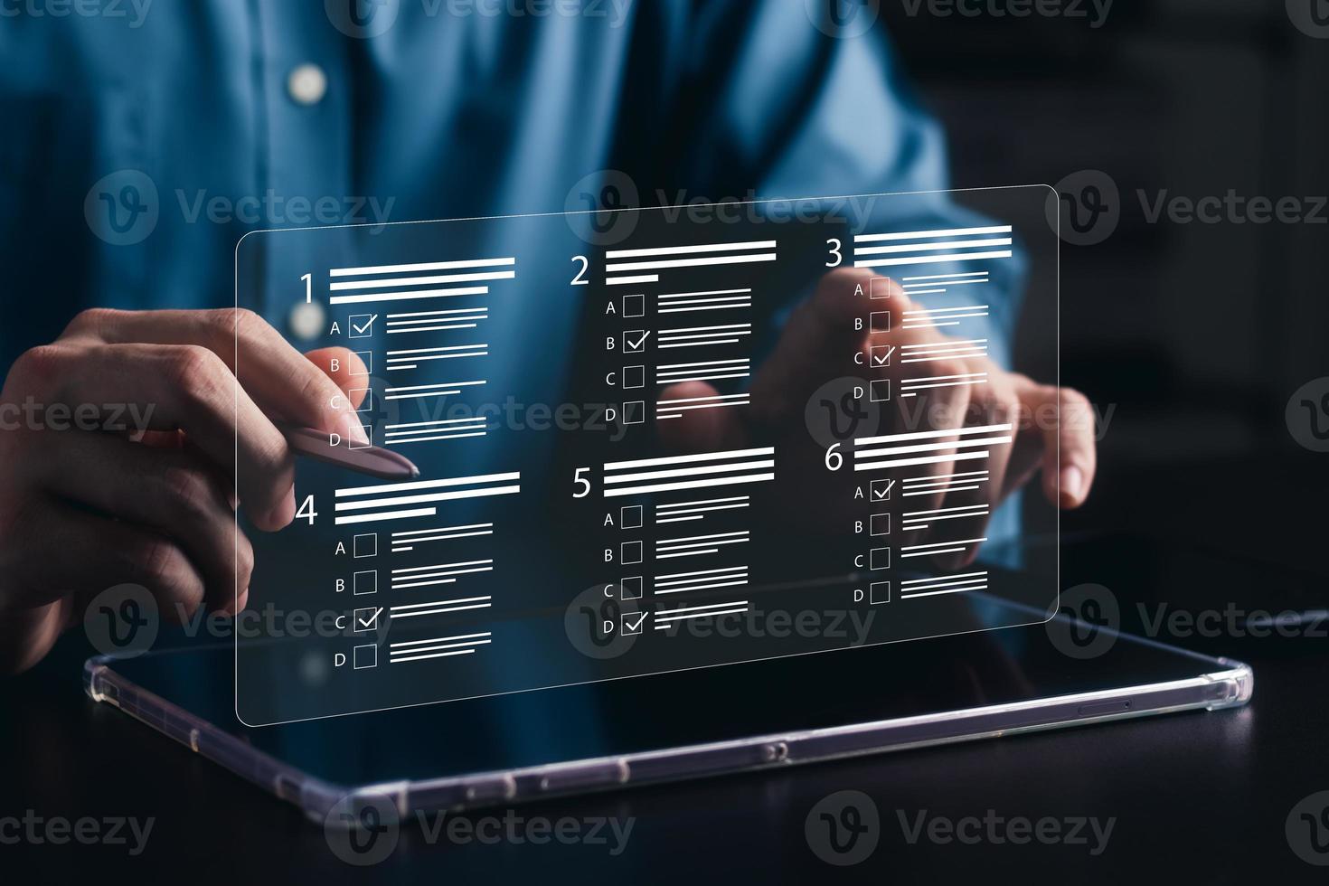 businessman using laptop to do online survey online exam Choosing the right answer in the exam, filling out an online survey form. Answer the test questions. photo