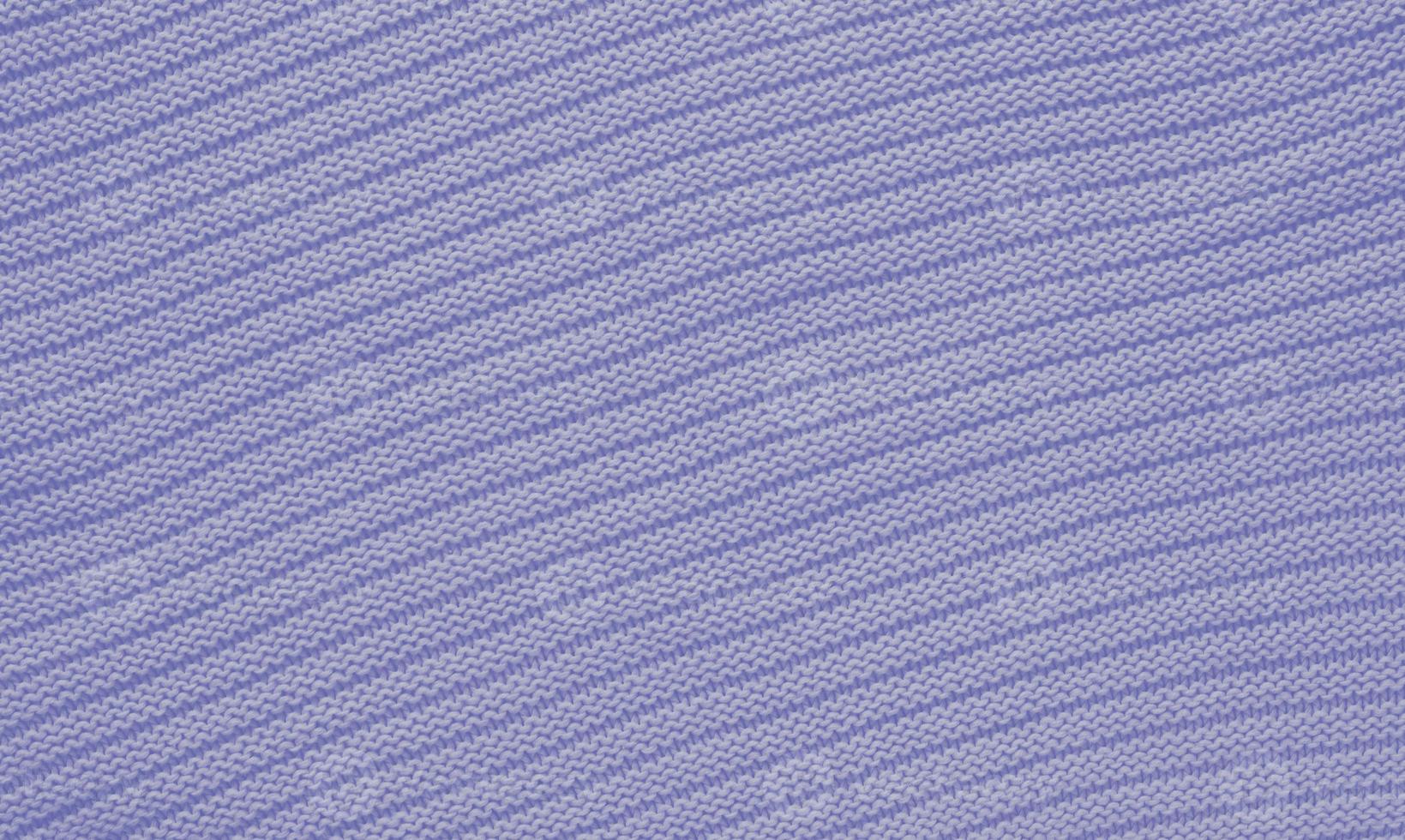 Texture of smooth knitted sweater with pattern. Handmade knitting wool or cotton fabric texture. Background of knitting patterns with horizontal stripes. photo