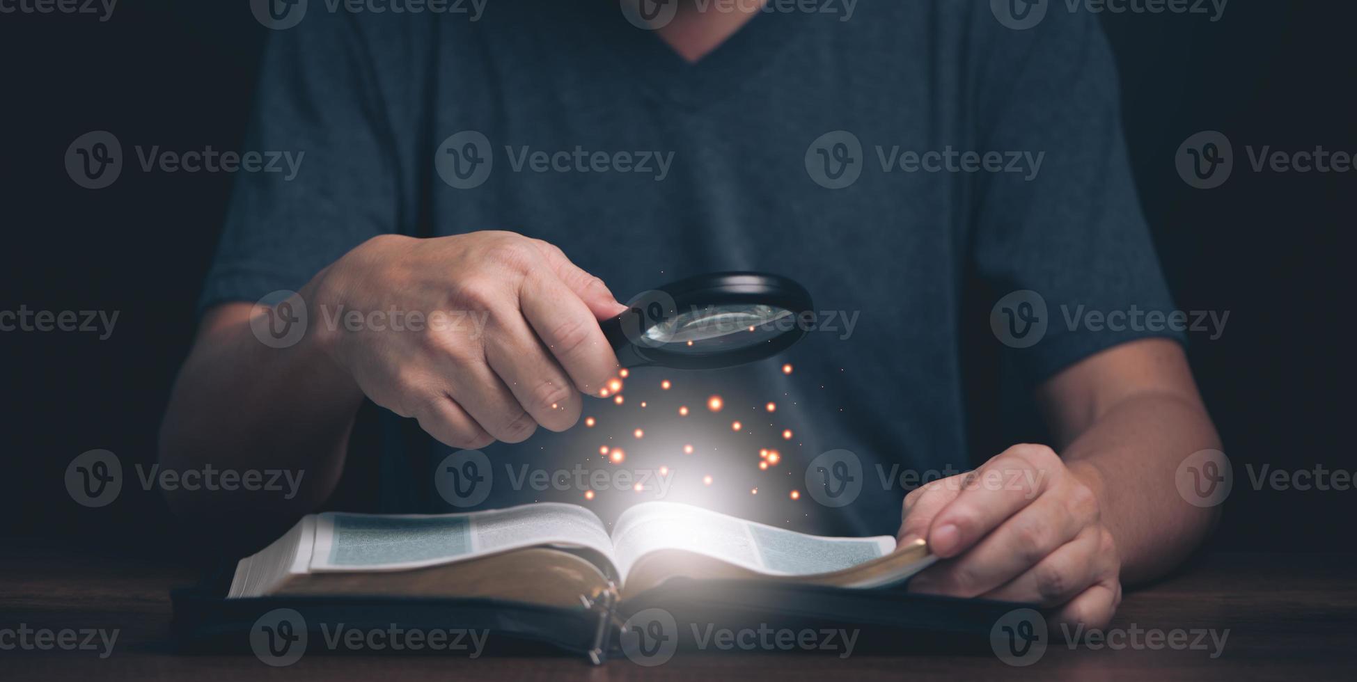 Man reading and search Holy Bible teaching spiritual word book with faith in religion and belief in god. Power of hope and devotion. photo