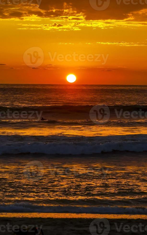 Colorful golden sunset big wave and beach Puerto Escondido Mexico. photo