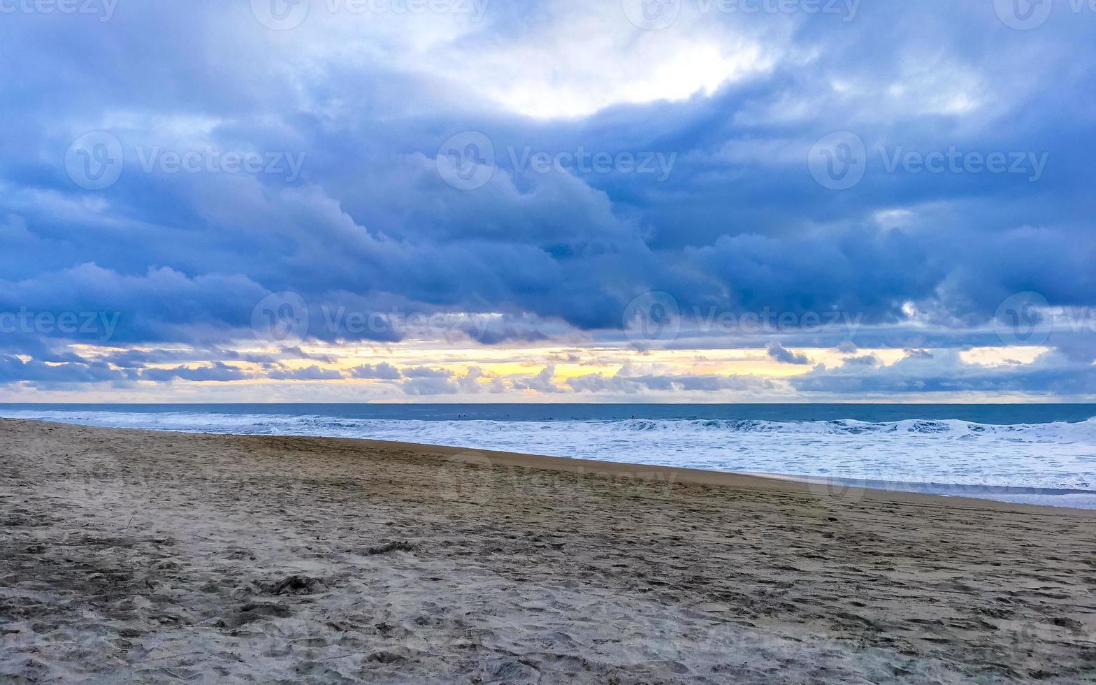 Colorful golden sunset big wave and beach Puerto Escondido Mexico. photo