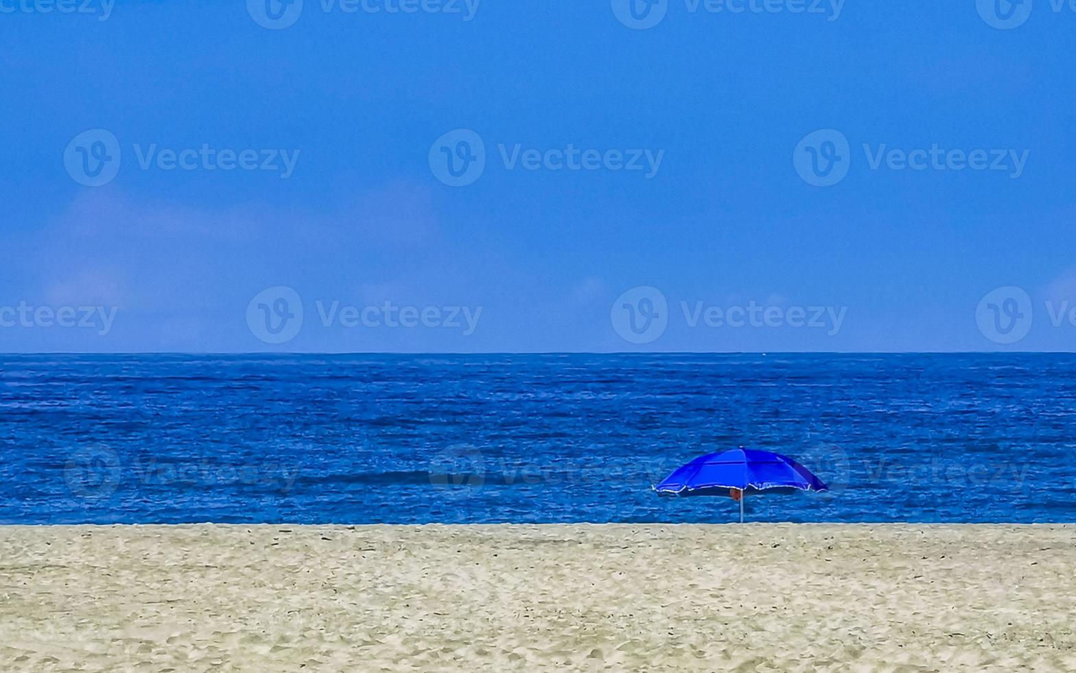 Beach sand blue water huge surfer waves Puerto Escondido Mexico. photo