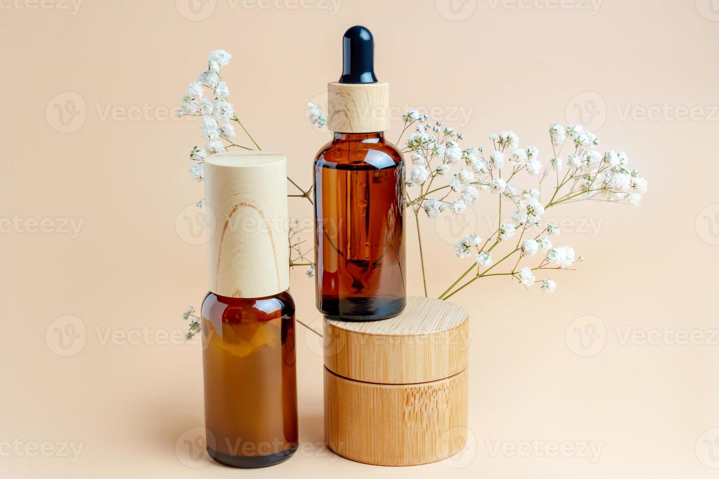 Skin Care Anti-Aging cosmetics. Face beauty serum, cream and essence in dark glass and bamboo packagin. Organic concept photo