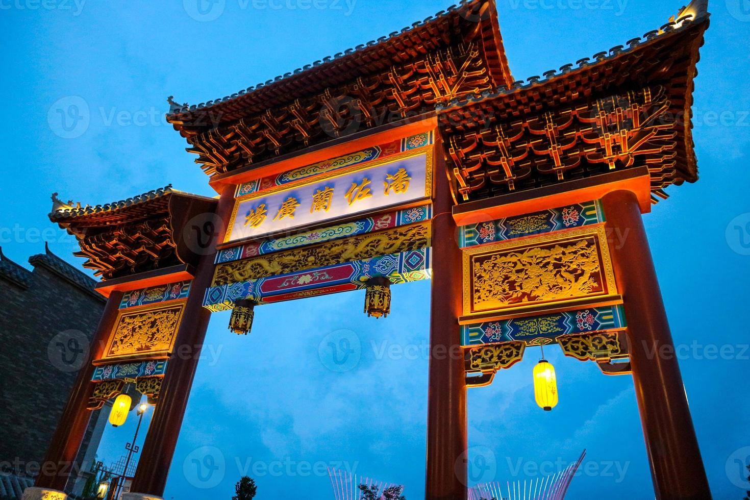 The entrance gate of Pantjoran PIK Chinatown with blue sky background. photo