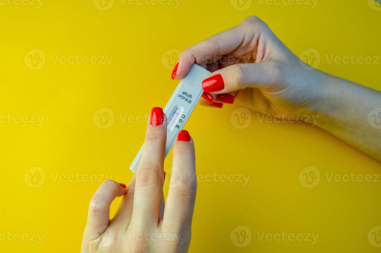 Self-testing of blood for viruses. The girl checks herself photo