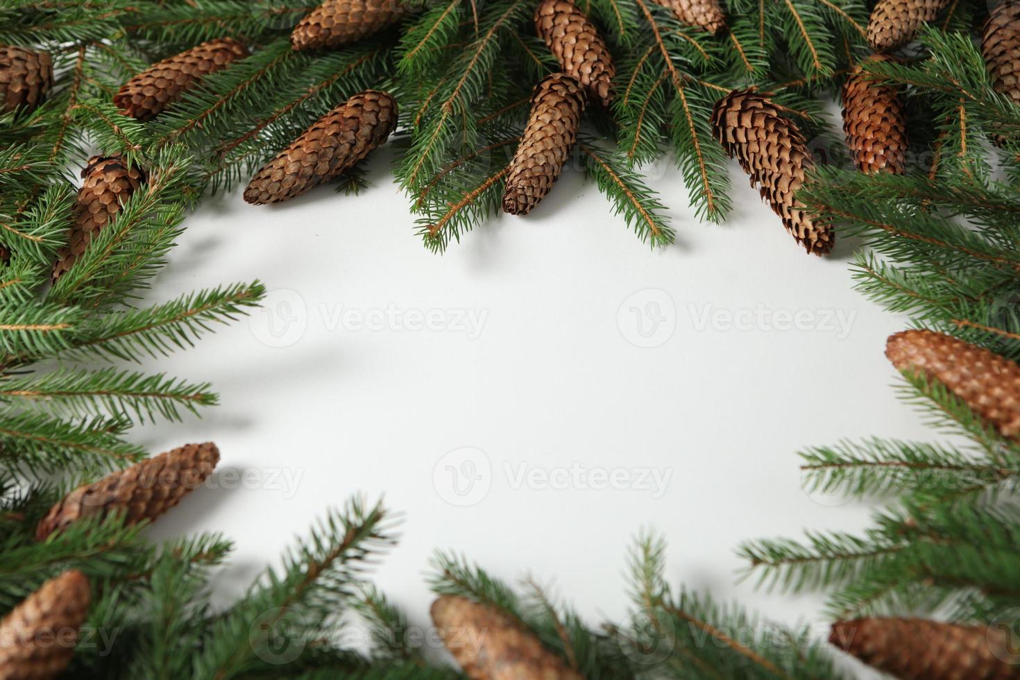 Holidays greeting card or banner composition with pine tree branches. Merry Christmas background and Happy New Year 2023. photo