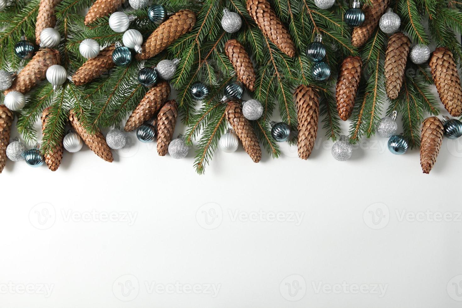 Holidays greeting card or banner composition with pine tree branches. Merry Christmas background and Happy New Year 2023. photo