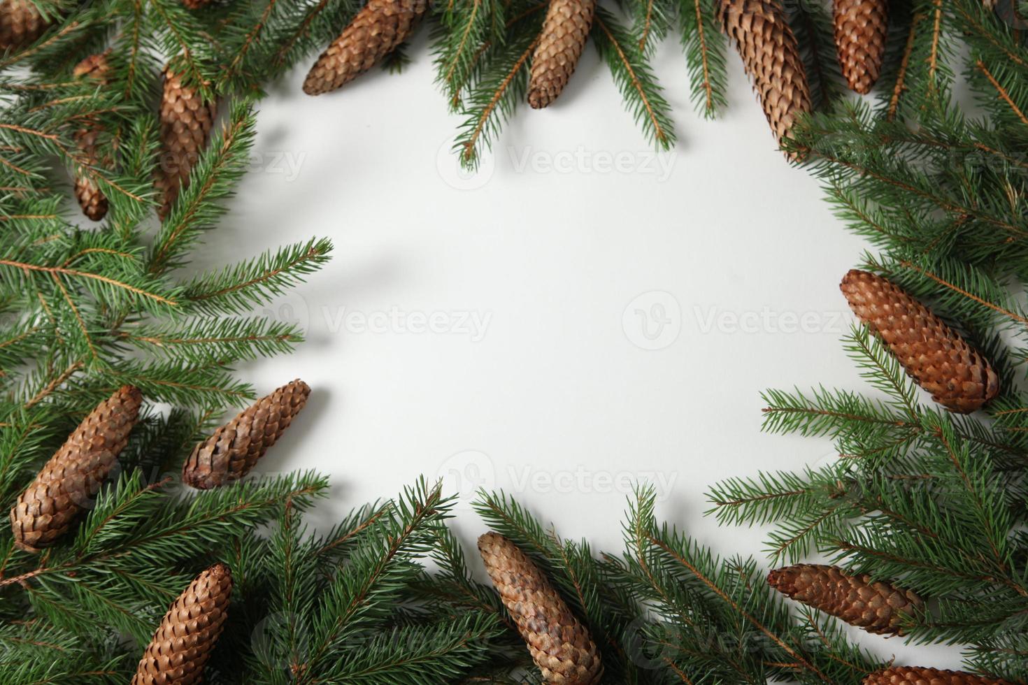 Holidays greeting card or banner composition with pine tree branches. Merry Christmas background and Happy New Year 2023. photo