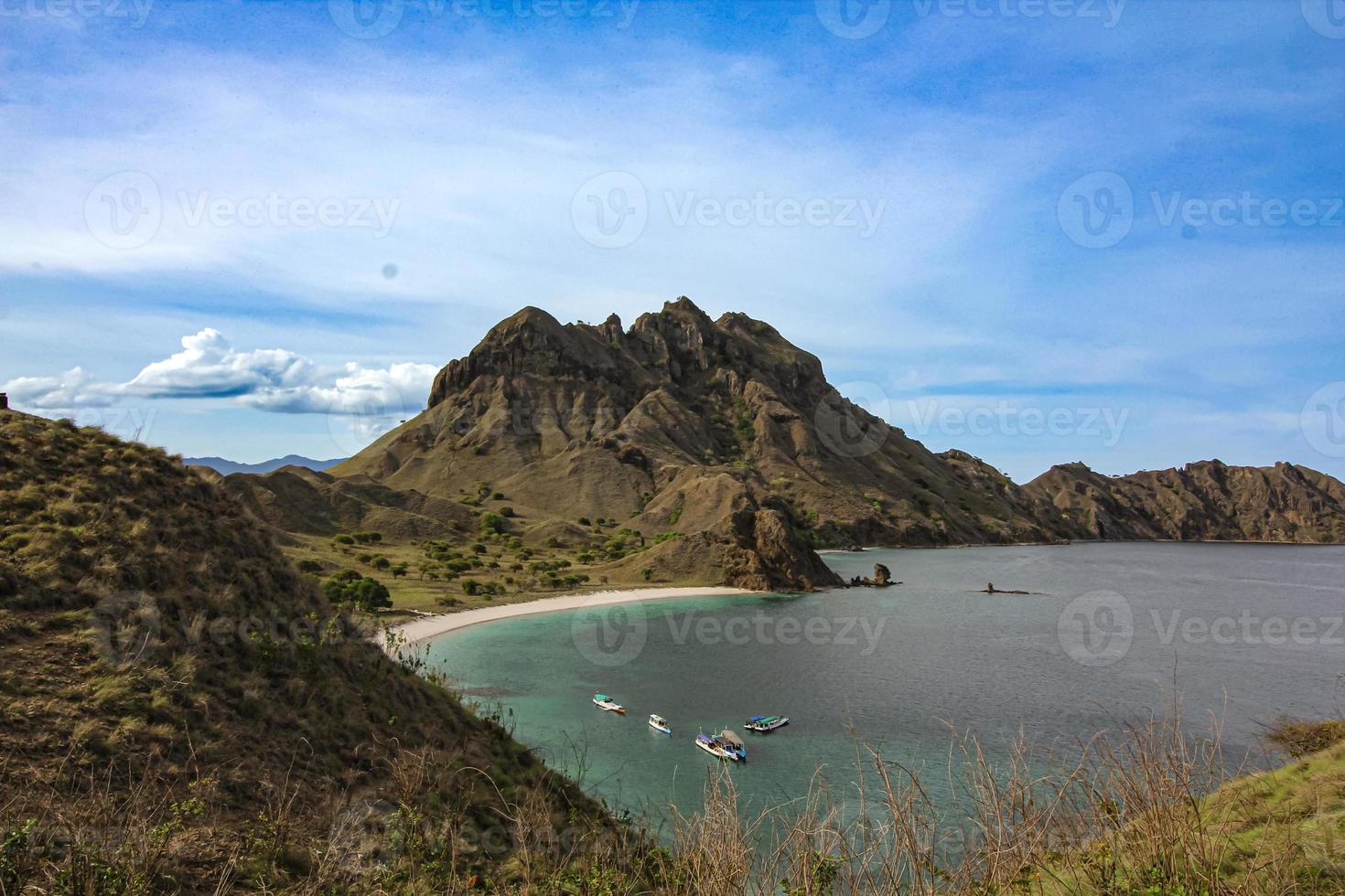 Beautiful View From The Top of Gili Lawa Darat Island in the Evening with Blue Sky and Blue Sea. Komodo National Park, Labuan Bajo, Flores, Indonesia photo