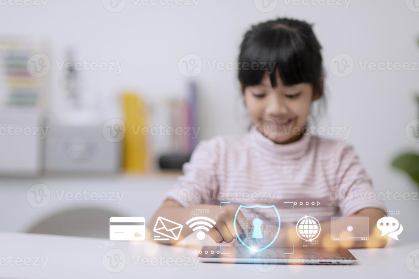 Child safety online. Little girl using tablet at home. icon of