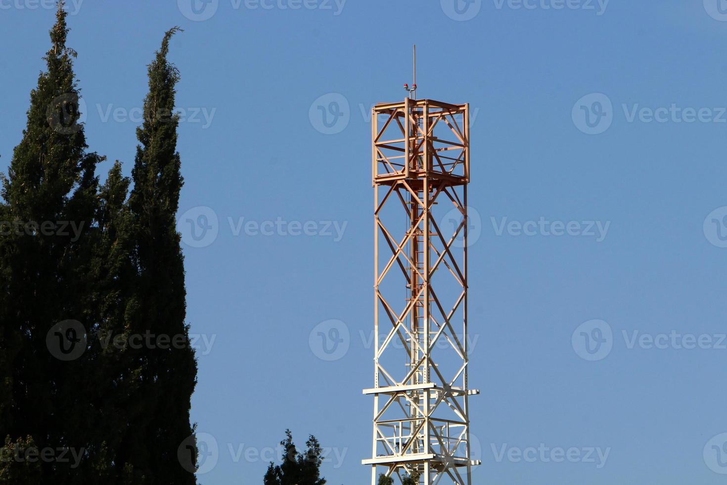 High antenna for emitting and receiving radio waves. photo