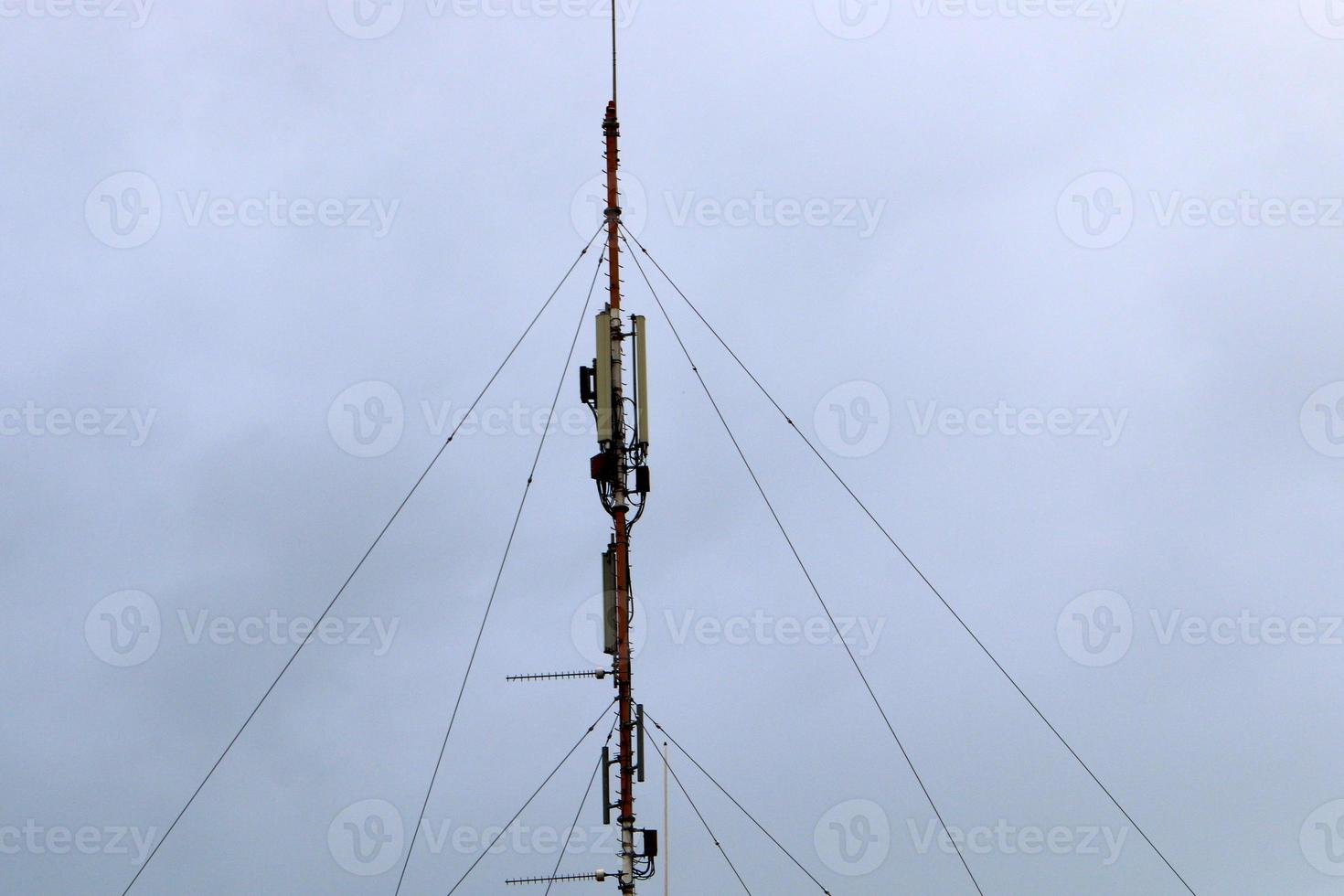 High antenna for emitting and receiving radio waves. photo