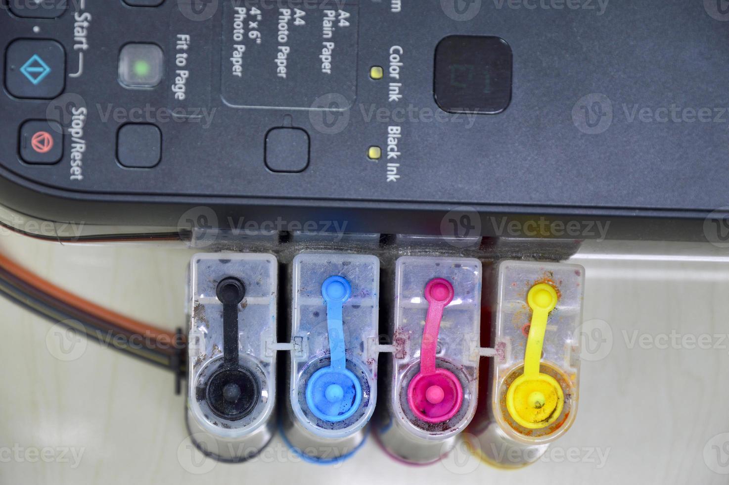Top view of the printer's ink cartridge, available in 4 colors. photo