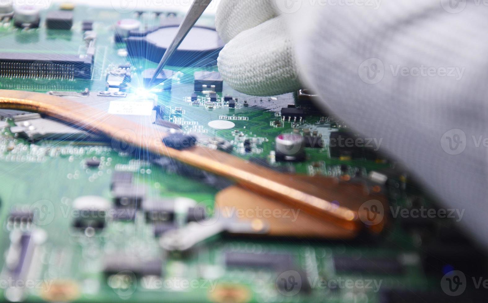 View from the top while a technician is fixing the motherboard. photo