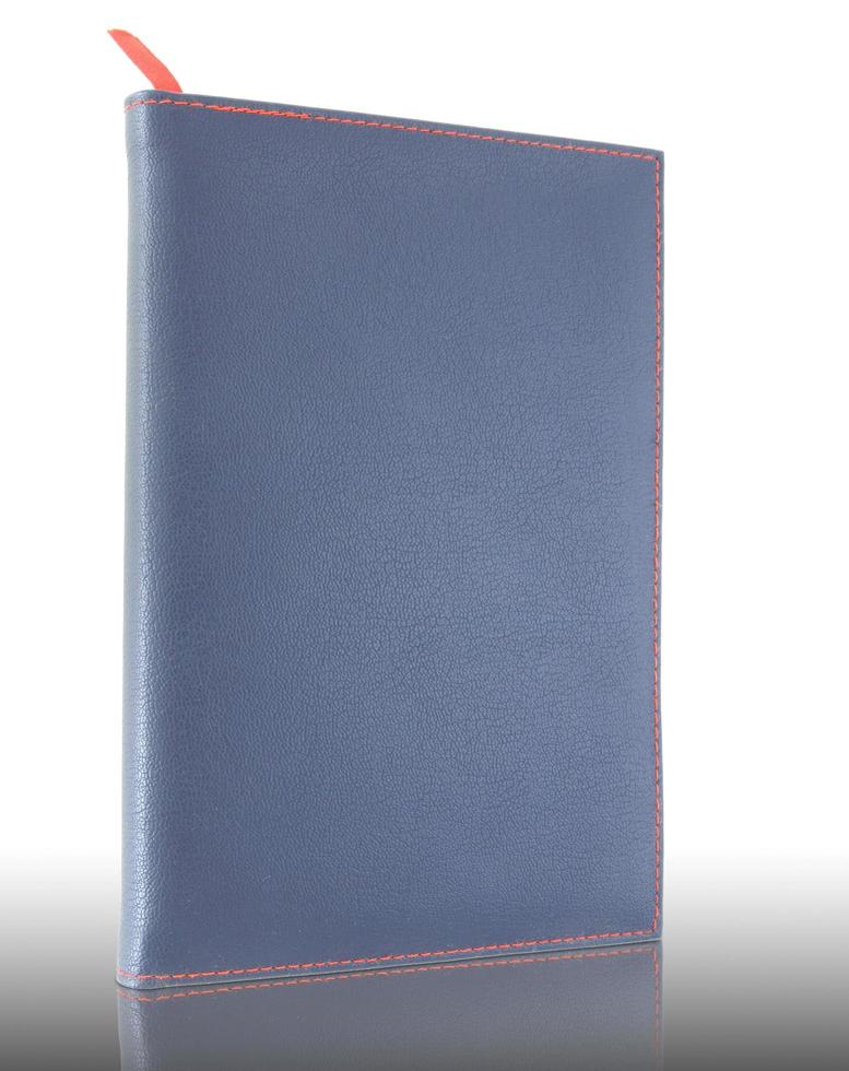blue leather notebook on reflect floor and white background photo