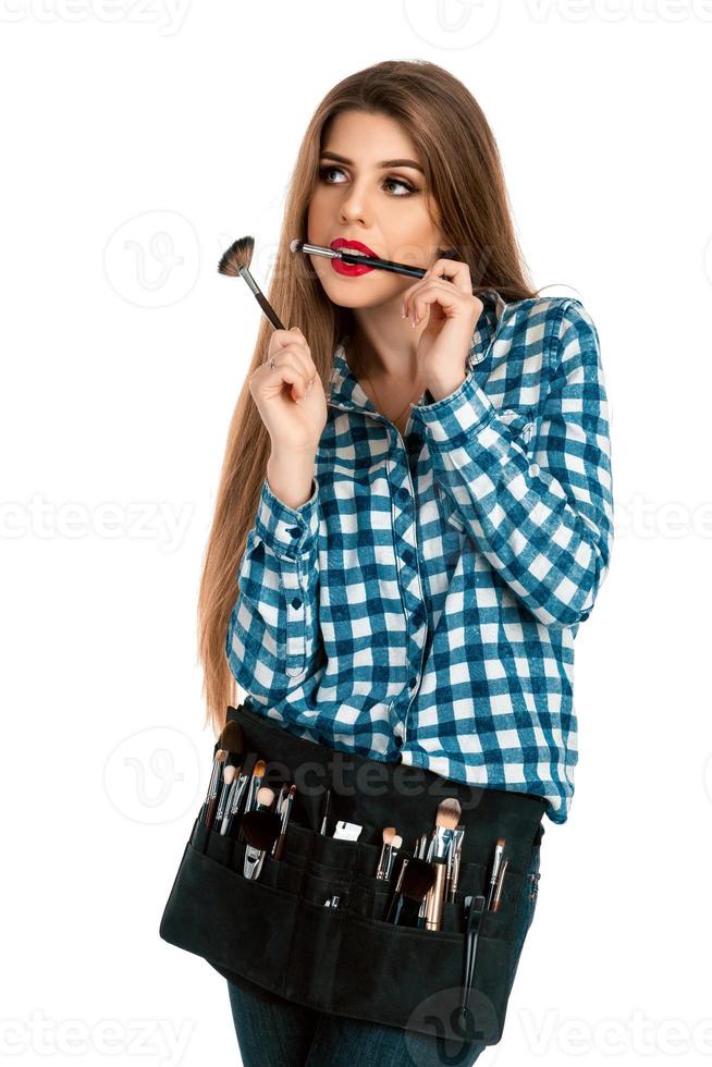 Fashion girl in casual clothes makes a make-up photo