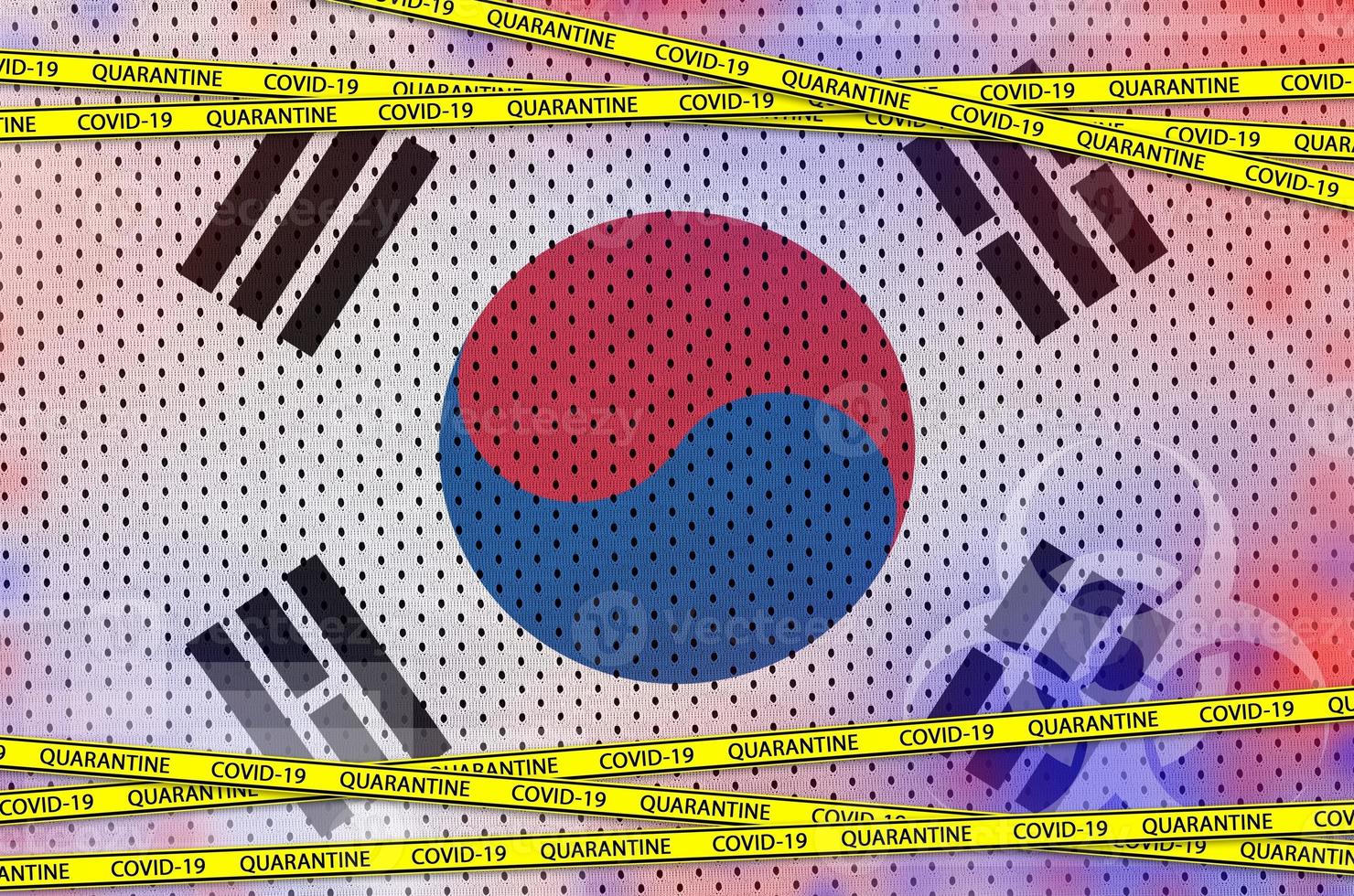 South Korea flag and Covid-19 quarantine yellow tape. Coronavirus or 2019-nCov virus concept photo