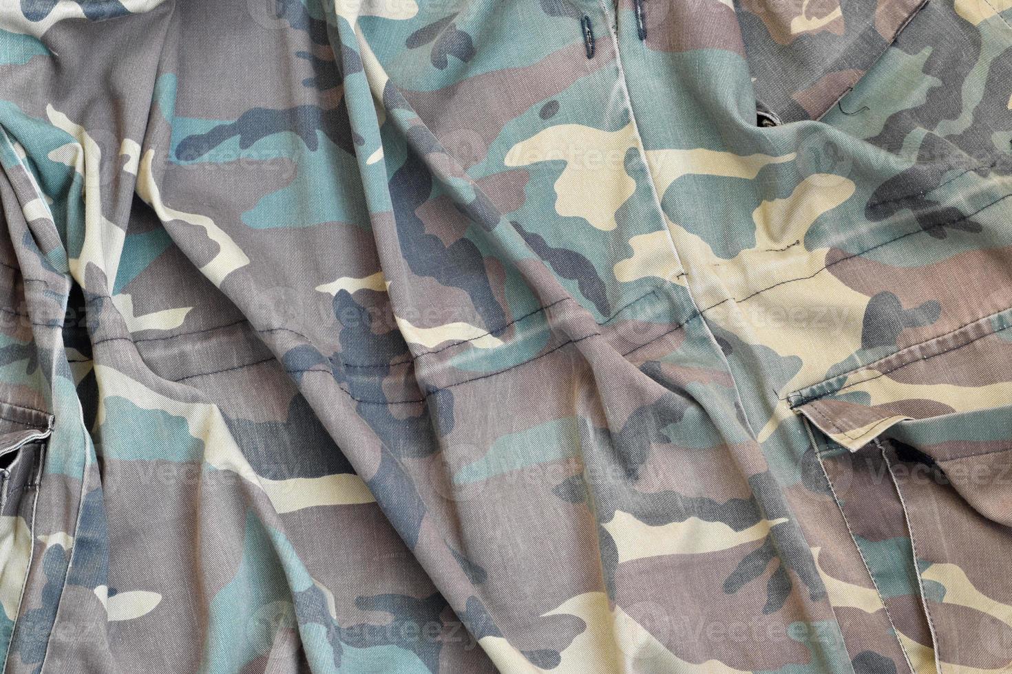 Camouflage background texture as backdrop for hunting or fishing design projects photo