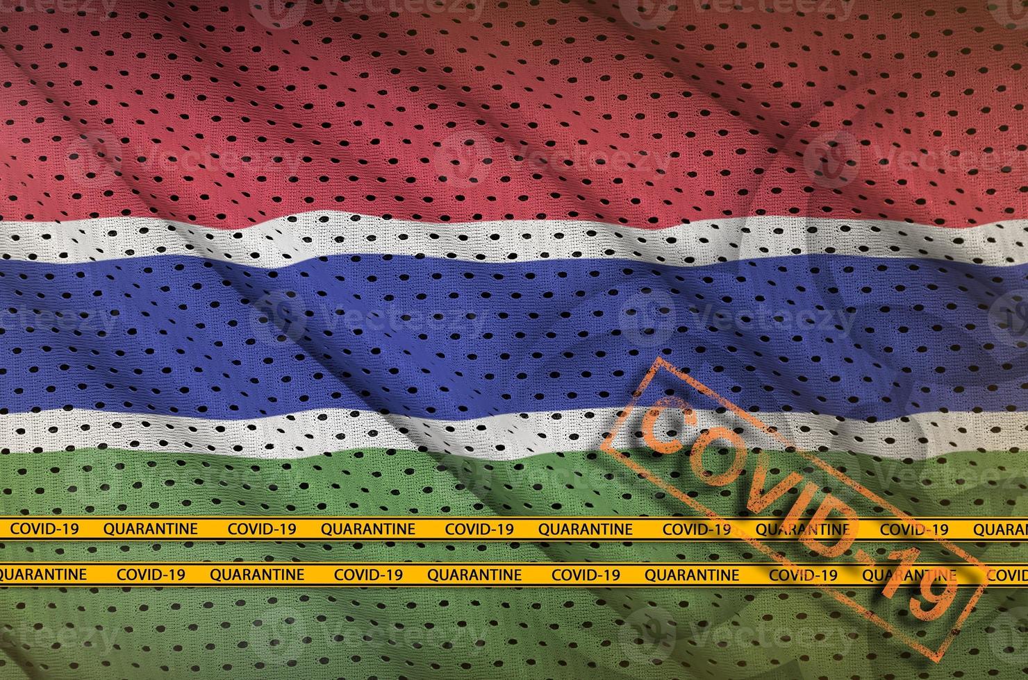 Gambia flag and orange Covid-19 stamp with border tape. Coronavirus or 2019-nCov virus concept photo