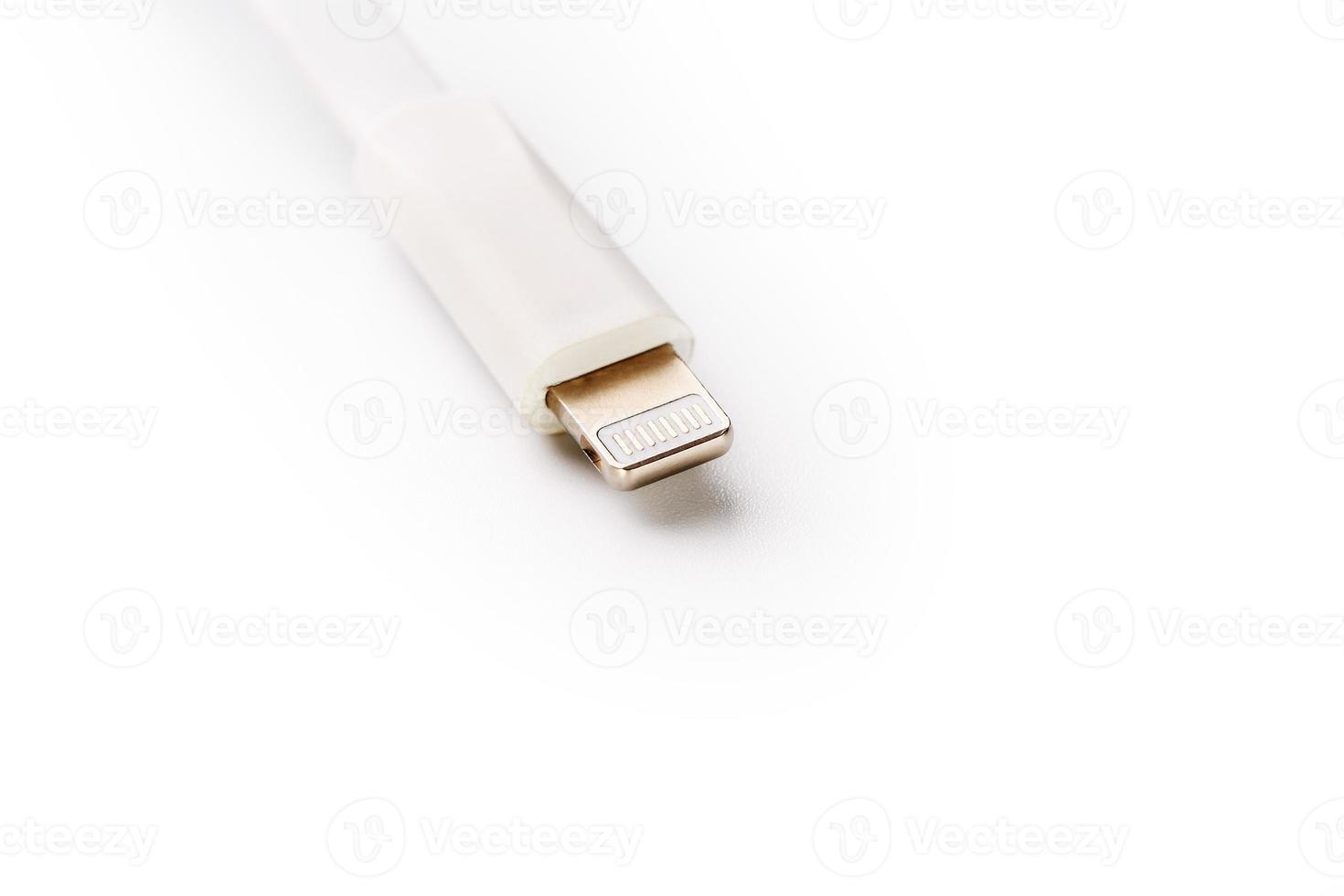 Connector lightning on a white background. This is a proprietary connector used to connect mobile devices to well-known host computers photo