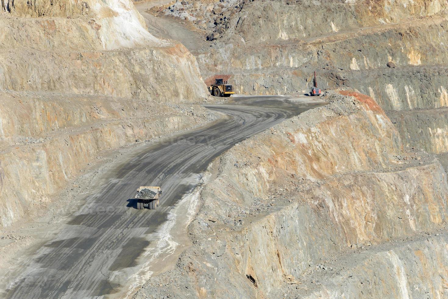 View of Mining activity in Minas de Riotinto in Spain. Apocalypse scenery. Mining village in Andalusia. Earth destruction. Disruption of nature. Extracting natural resources from the Earth. photo