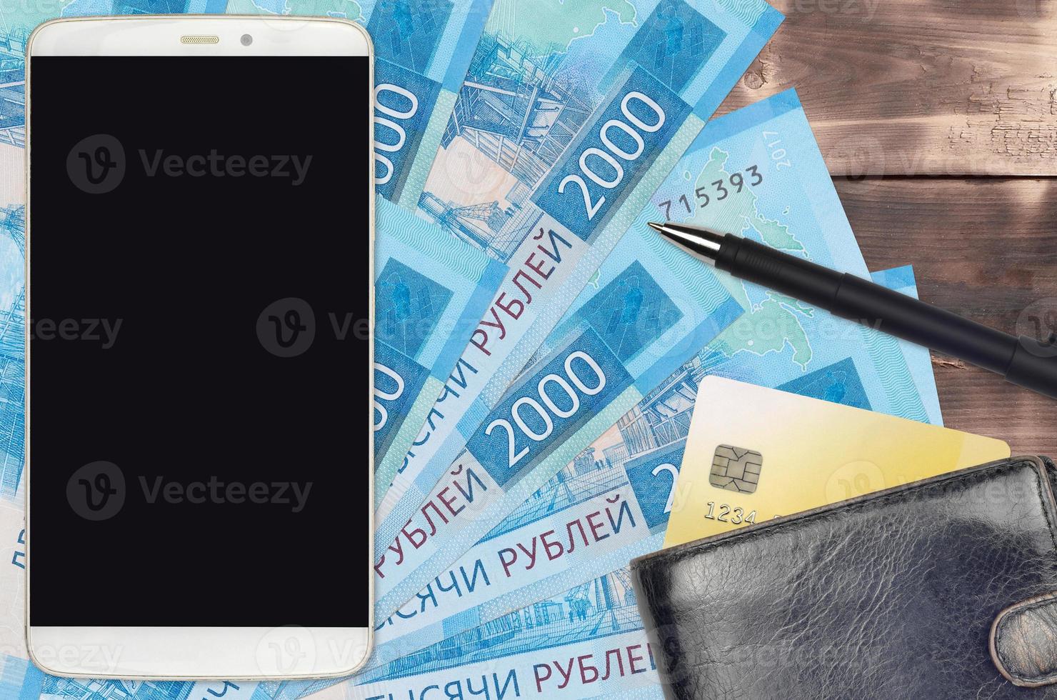 2000 russian rubles bills and smartphone with purse and credit card. E-payments or e-commerce concept. Online shopping and business with portable devices photo