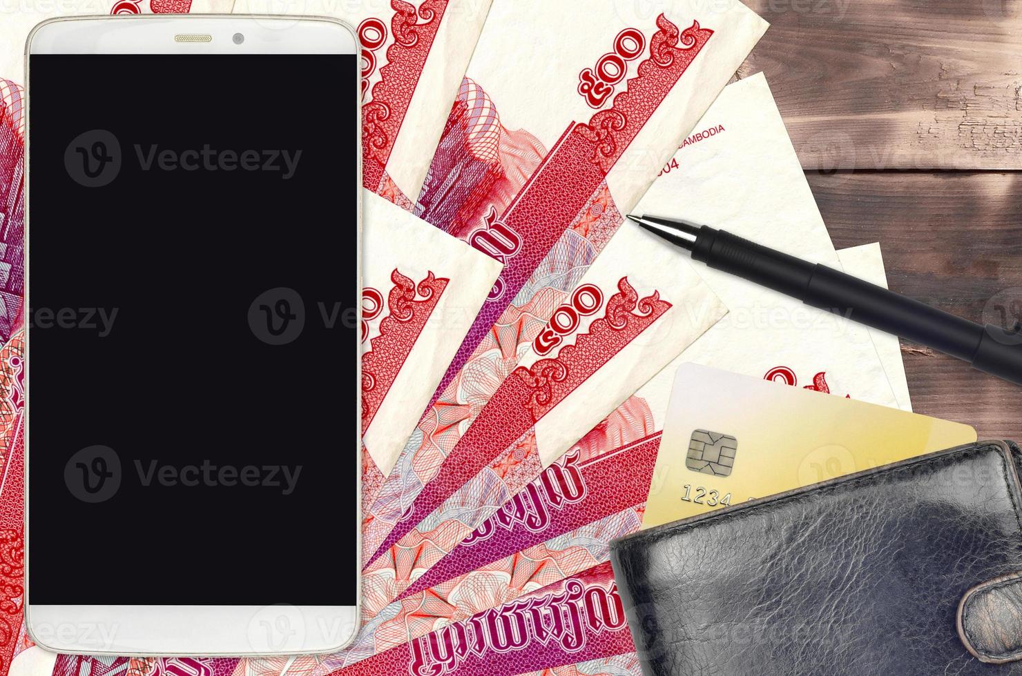 500 Cambodian riels bills and smartphone with purse and credit card. E-payments or e-commerce concept. Online shopping and business with portable devices photo